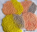 A few decorative cookies on a white plate.