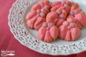 A close up of owl-shaped desserts on a decorative white plate.
